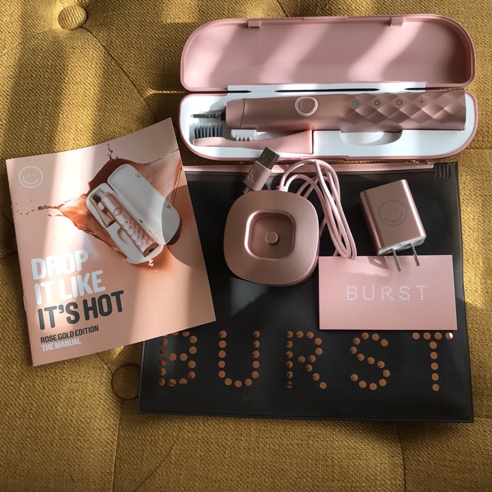 Rose gold BURST electric toothbrush.